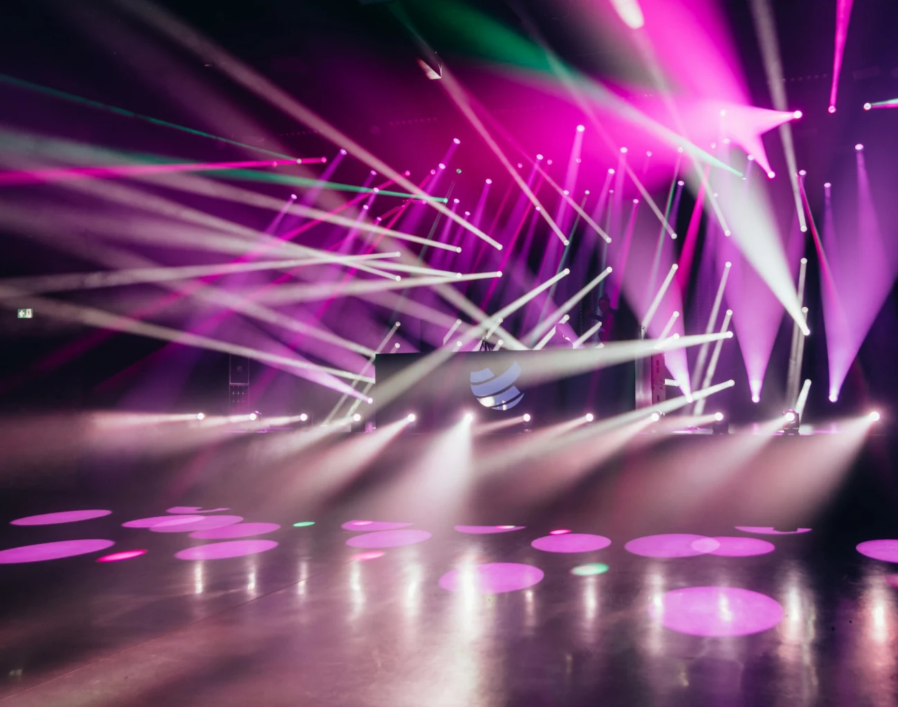 Corporate event stage with purple and blue lighting for an LED performance