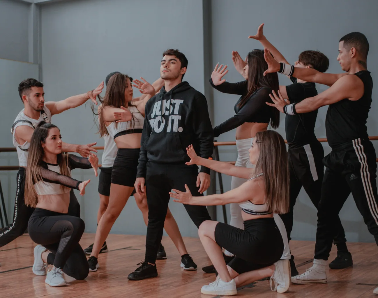 Professional dancers rehearsing choreography together before a corporate stage show
